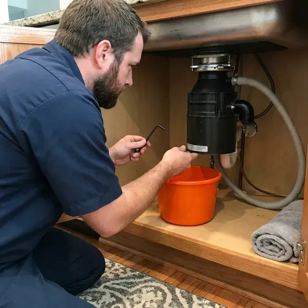BFK Plumbing technician providing garbage disposal repair in Louisville, KY
